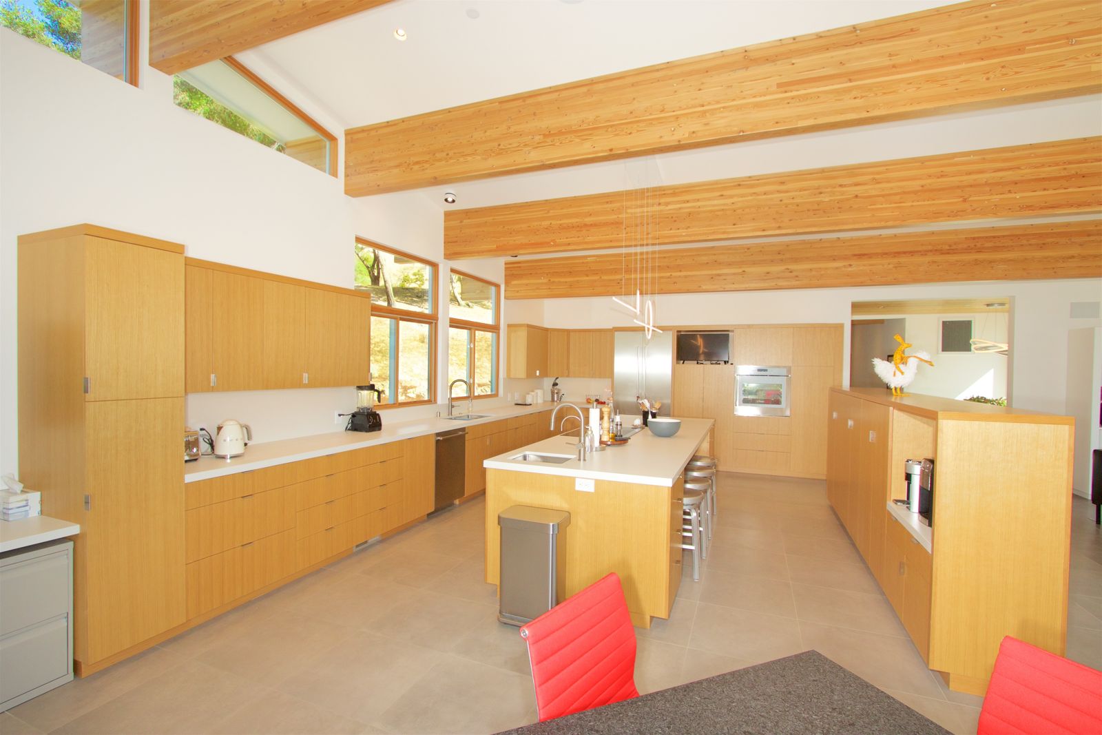Modern kitchen with white oak cabinetry and exposed beams, Sonoma County.