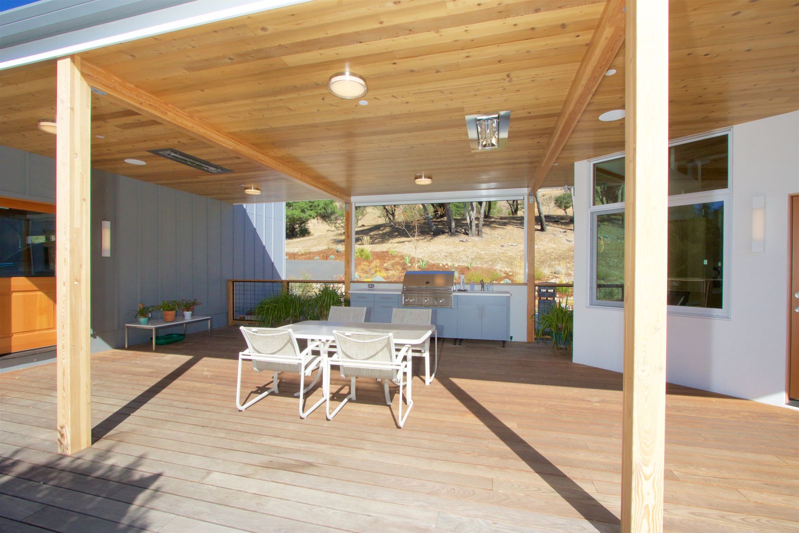 Covered outdoor room with tongue-and-groove cedar ceiling