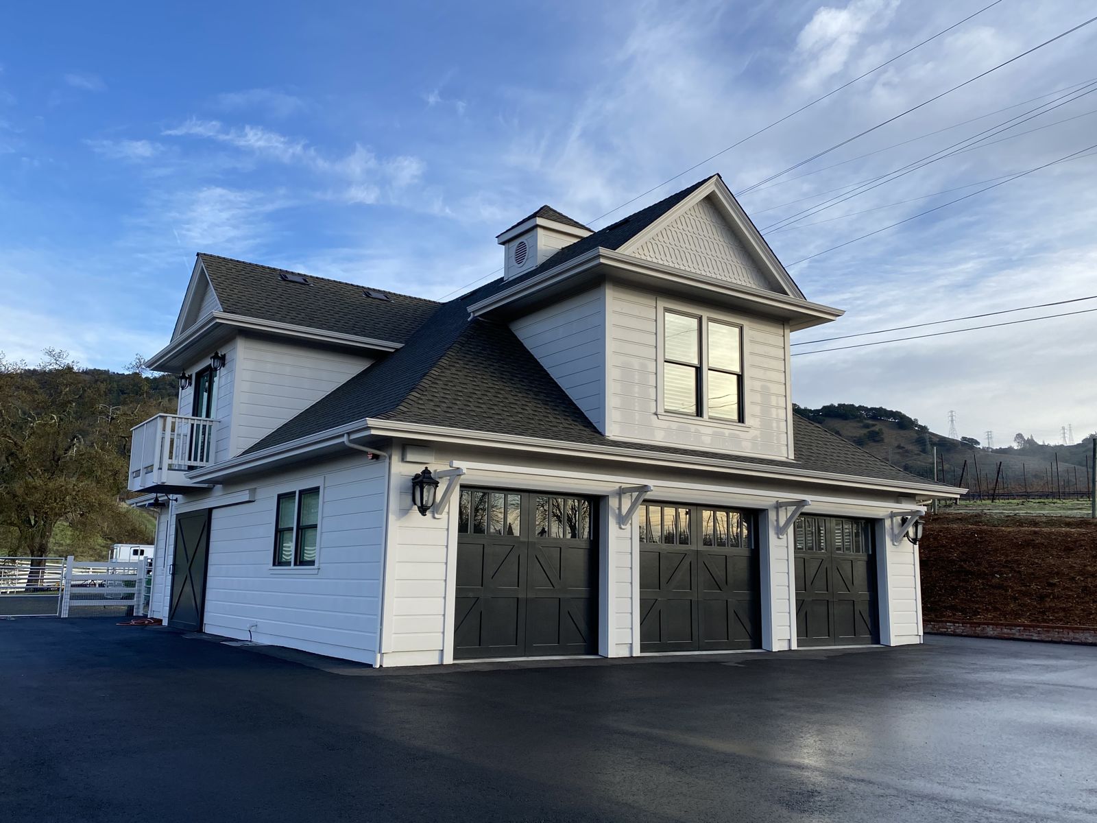 Carriage house with carriage-style doors and cupola