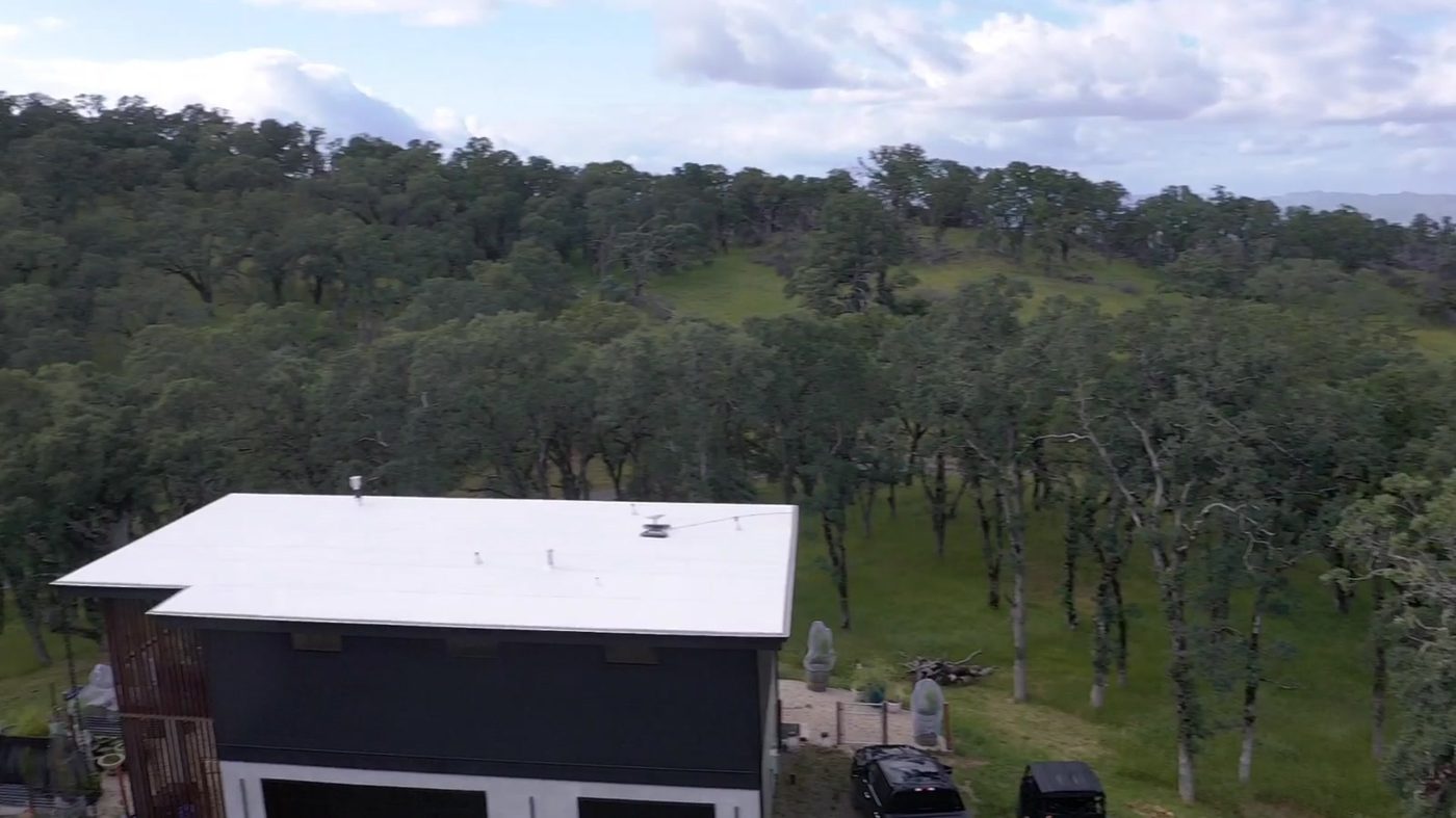 Aerial view of the Napa Valley Lindal home site showing the main structure and accessory building on the oak property.
